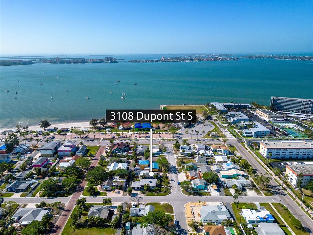 An aerial view shows a residential neighborhood located along a coastal waterfront — 3108 DUPONT STREET S, GULFPORT, FL