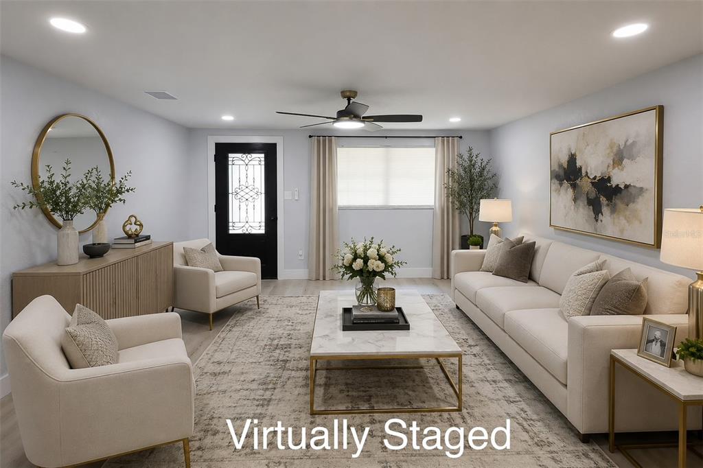 A single-story house with a beige exterior, a concrete driveway, and a front porch — 505 CLEARFIELD ROAD, BRANDON, FL