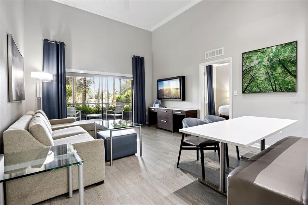 Aerial view of a large resort complex featuring multiple pools, water slides, and surrounding lakes — 14501 GROVE RESORT AVENUE UNIT 1111, WINTER GARDEN, FL