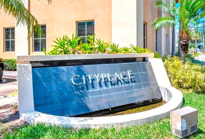 A stone monument sign with the name CityPlace sits in front of a tan building — 1550 W CLEVELAND STREET UNIT 2, TAMPA, FL