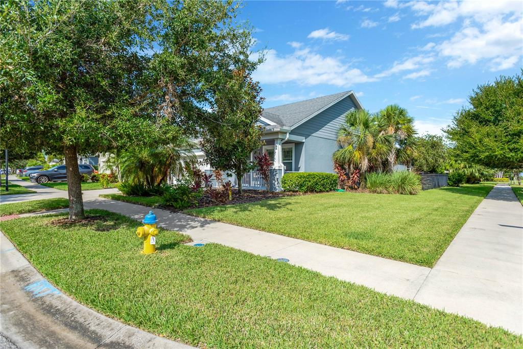 A single-story house with a gray exterior, a front porch, and a yellow fire hydrant — 6420 SEASOUND DRIVE, APOLLO BEACH, FL