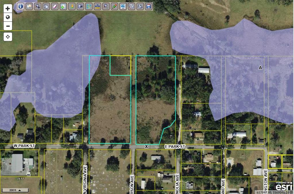 This is a map showing two adjacent vacant lots outlined in blue on a street — TBD E PARK STREET, CENTER HILL, FL