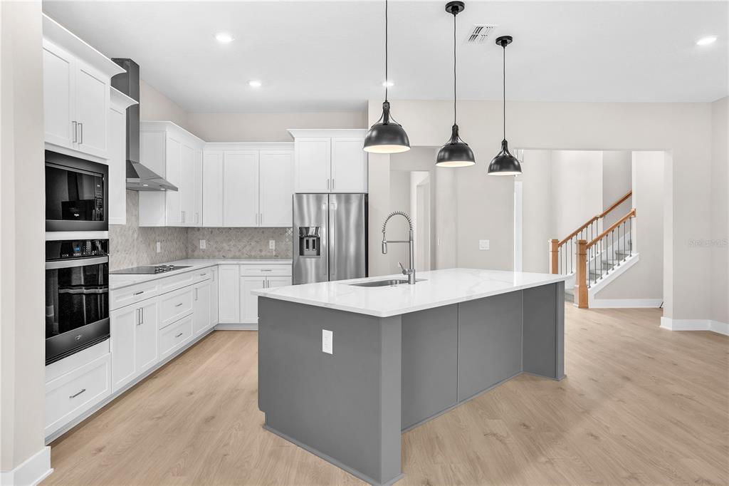 This is a floor plan for a single-story house featuring four bedrooms and a garage — 13510 HAFLINGER WAY, HUDSON, FL