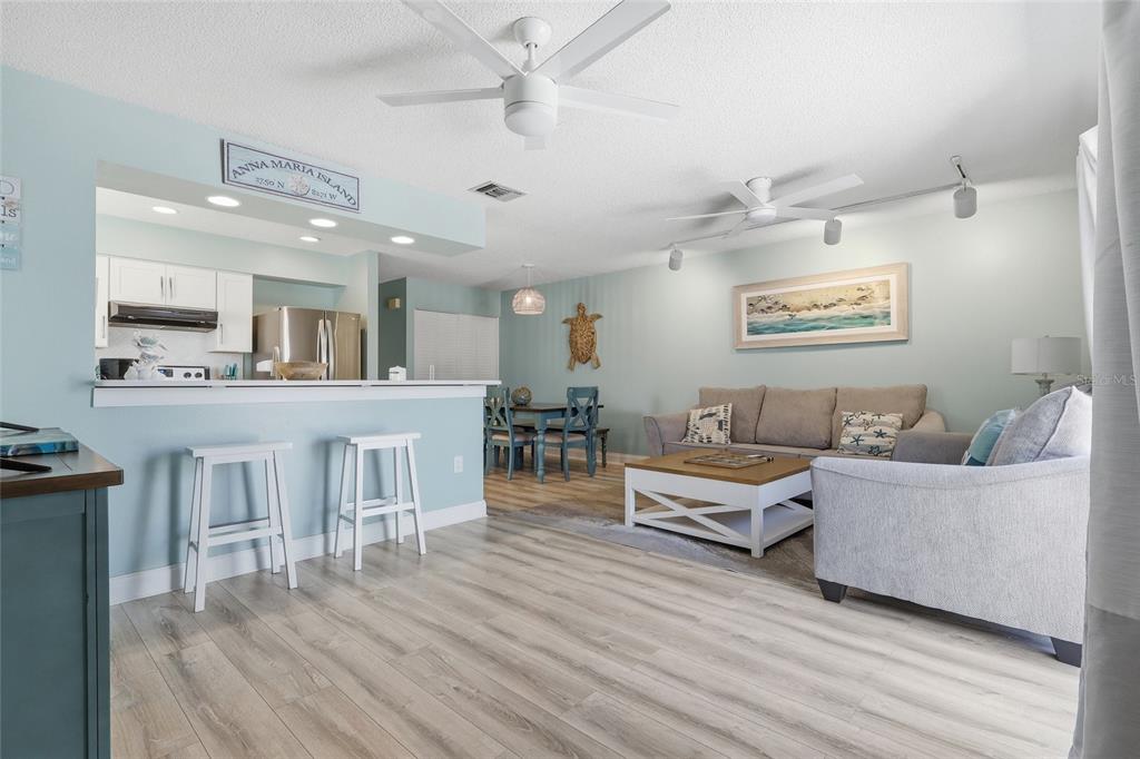An aerial view of a coastal neighborhood with a white circle highlighting a specific house — 207 71ST STREET UNIT E, HOLMES BEACH, FL