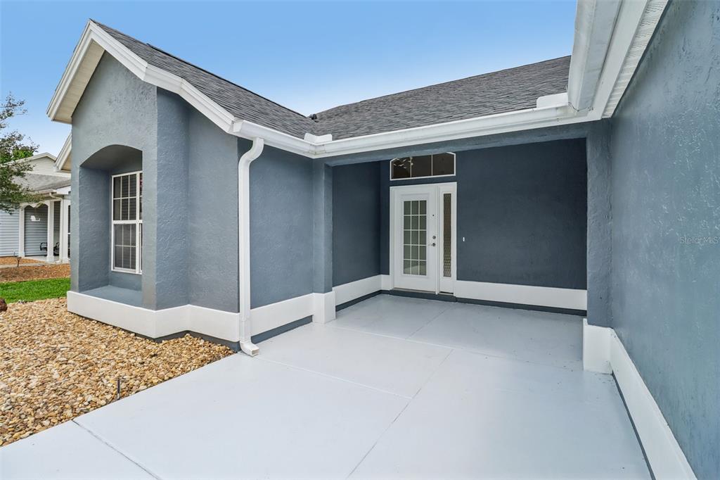 This is a floor plan for a single-story house with three bedrooms and a garage — 207 DESOTA COURT, THE VILLAGES, FL