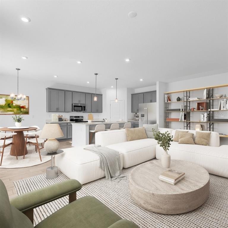 This is a rendering of an open-concept living room and kitchen with gray cabinetry — 1090 CLAY BOULEVARD, TAVARES, FL