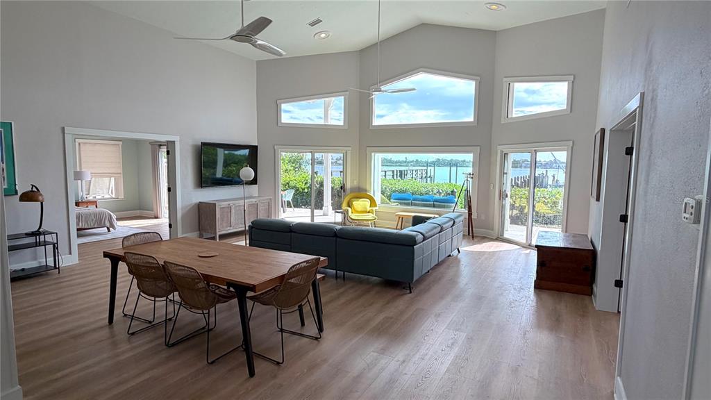 An aerial view of waterfront houses with private docks along a calm bay — 1275 PORT LANE, SARASOTA, FL