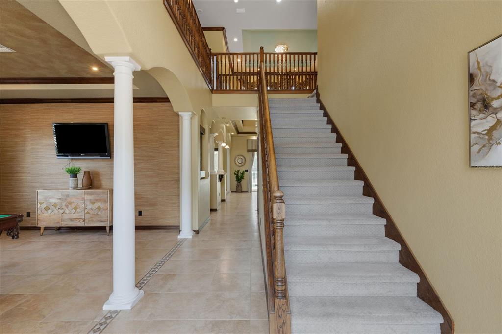 The front entrance features a double door with glass inserts, stone steps, and white columns — 3021 59TH AVENUE S, ST PETERSBURG, FL