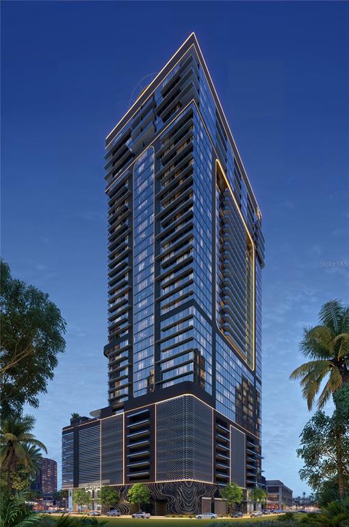 A rendering of a modern high-rise residential tower at dusk with illuminated balconies and facade — 1101 E JACKSON STREET UNIT 3602, TAMPA, FL
