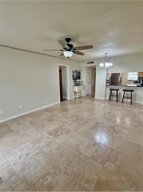 An interior view shows a tiled entryway with a doorway, a hallway, and a glass door — 3815 N OAK DRIVE UNIT G71, TAMPA, FL