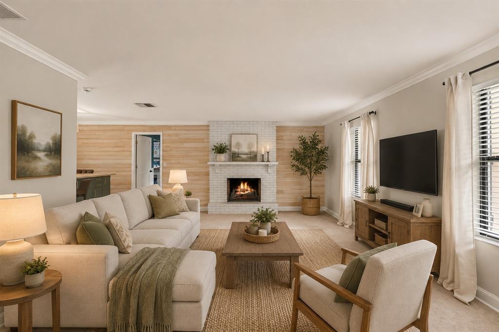 A living room features a white brick fireplace, wood-paneled walls, and neutral-toned furniture — 442 HOMER AVENUE, LONGWOOD, FL
