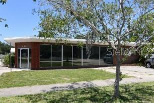 A fenced commercial lot features a concrete parking area and a Therm-O-Tane Gas Co. building — 414 W 9TH STREET, SANFORD, FL