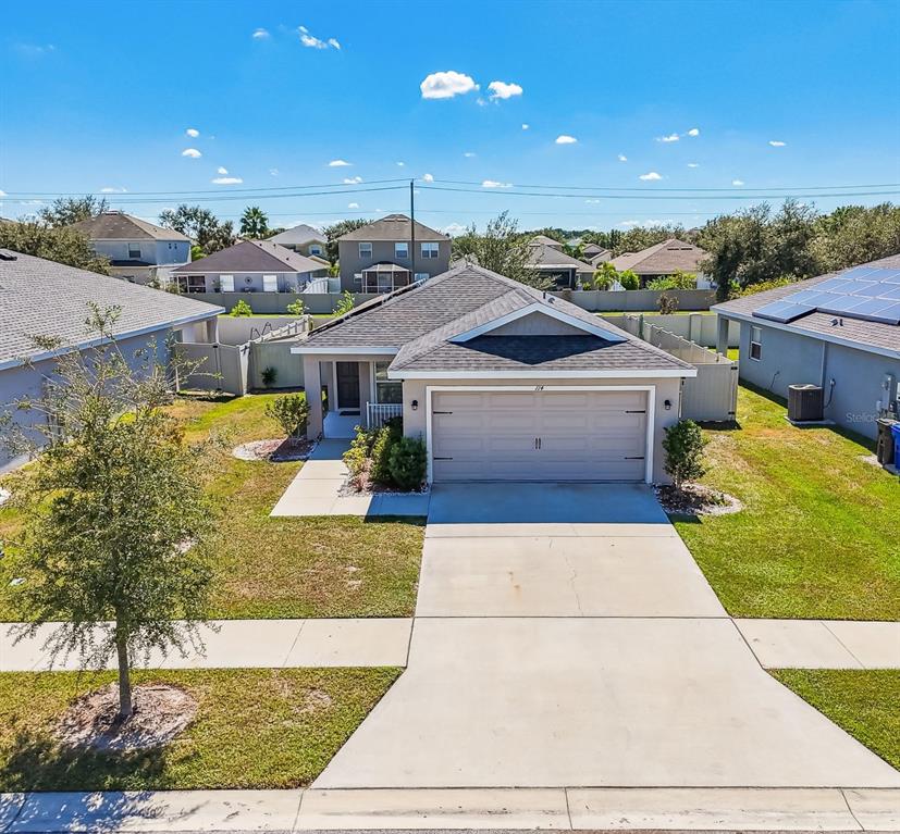 An aerial view of a single-story suburban house with a two-car garage and driveway — 114 EAGLE SUMMIT DRIVE, RUSKIN, FL