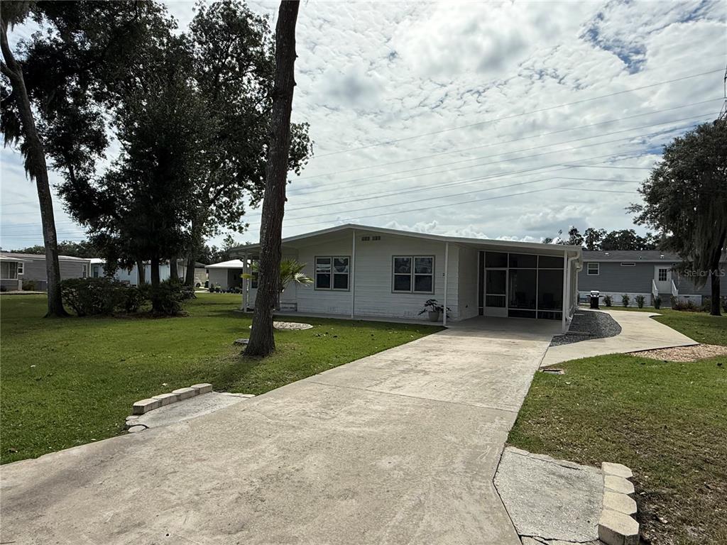 26 S BOBWHITE ROAD, WILDWOOD, FL — photo 2 of 30
