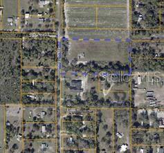 This is an aerial map showing a rectangular property parcel outlined in blue — 1702 30TH STREET SE, RUSKIN, FL