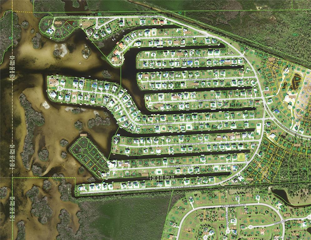 This is an aerial map of a residential waterfront community with canal-front properties — 24360 BLACKBEARD BLVD, PUNTA GORDA, FL