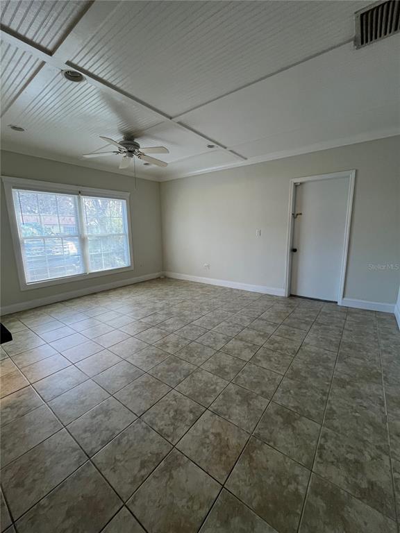 A room with beige tile flooring, a white beadboard ceiling, and a ceiling fan — 3222 HAMMERSMITH ROAD, ORLANDO, FL