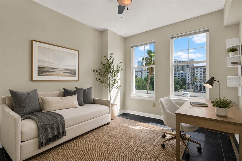 A home office with a daybed, desk, and large windows overlooking a city view — 345 BAYSHORE BOULEVARD UNIT 310, TAMPA, FL