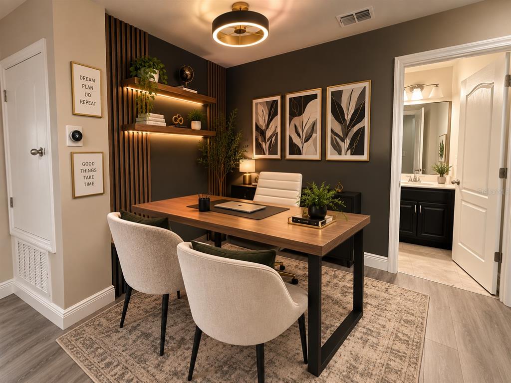 A kitchen with dark cabinets and granite countertops opens to a dining and living area — 2749 PLEASANT CYPRESS CIRCLE, KISSIMMEE, FL