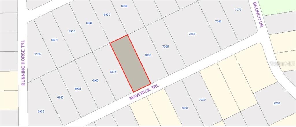This is a map showing a highlighted parcel of land along Maverick Trail — MAVERICK TRAIL, ST CLOUD, FL