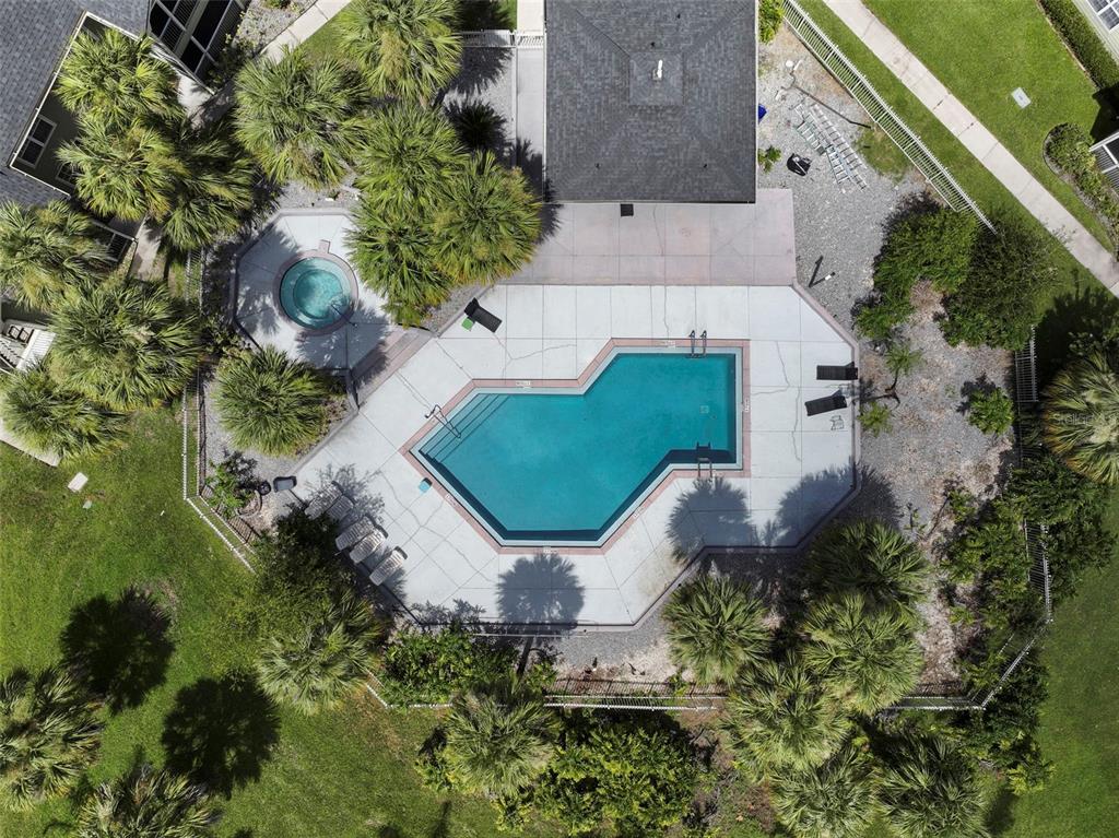 An aerial view shows a swimming pool and hot tub surrounded by a concrete deck — 3719 S LAKE ORLANDO PARKWAY UNIT 2, ORLANDO, FL