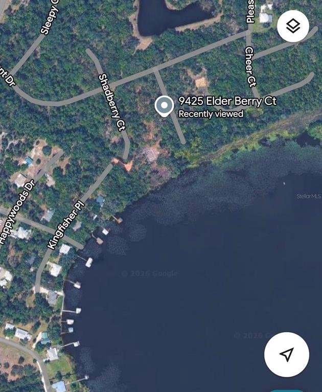 This is a satellite map view showing a residential area adjacent to a large lake — 9425 ELDER BERRY COURT, SEBRING, FL