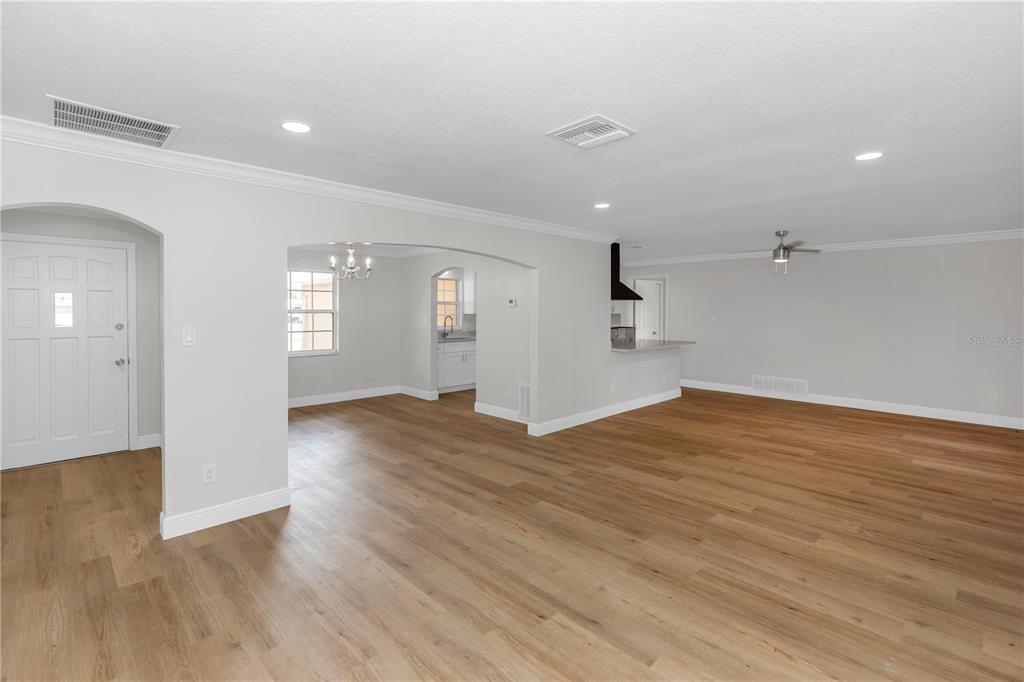 An aerial view shows two adjacent residential houses with driveways and a swimming pool — 4992 E WIND STREET, ORLANDO, FL