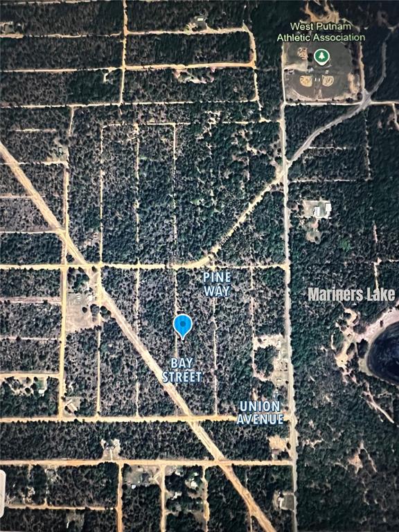 This is an aerial map showing a wooded area with streets and a nearby lake — xx BAY STREET, INTERLACHEN, FL