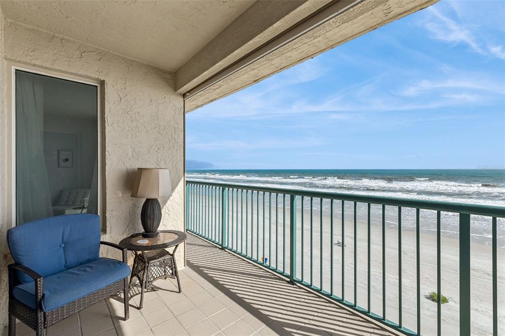 An aerial view of a multi-story beachfront condominium building with a central circular driveway — 4555 S ATLANTIC AVENUE UNIT 4506, PONCE INLET, FL