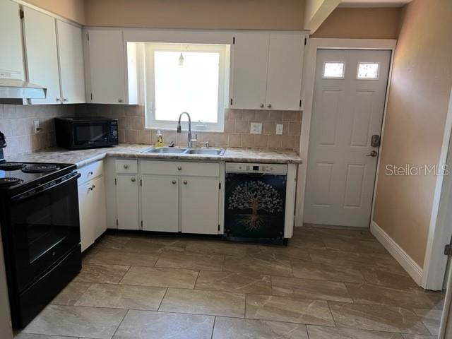 A room with light-colored walls and gray wood-look laminate flooring — 6890 VERSAILLES N UNIT 10, PINELLAS PARK, FL