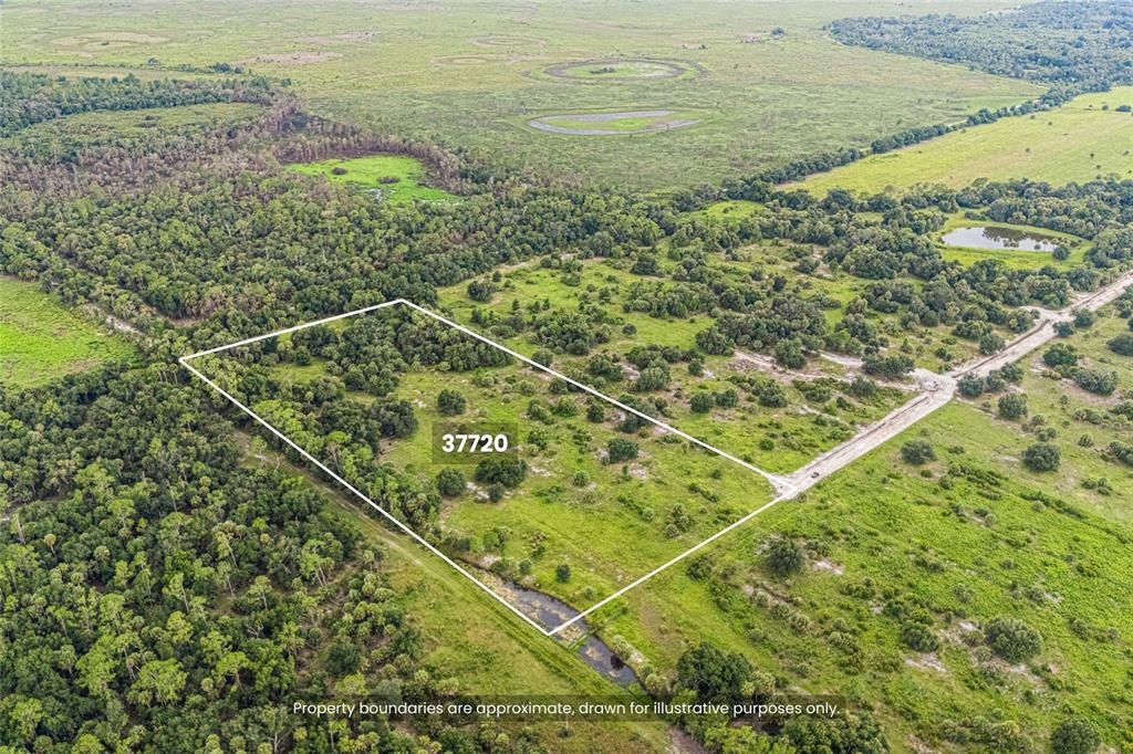 An aerial view shows a rectangular plot of land outlined in white within a rural landscape — 37720 KVILLE ROAD, MYAKKA CITY, FL