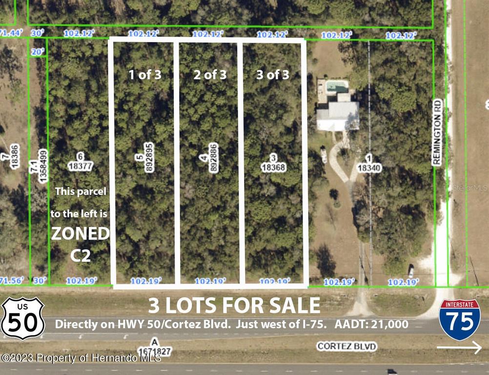 This is an aerial map showing three adjacent rectangular lots for sale along a highway — CORTEZ BOULEVARD, BROOKSVILLE, FL