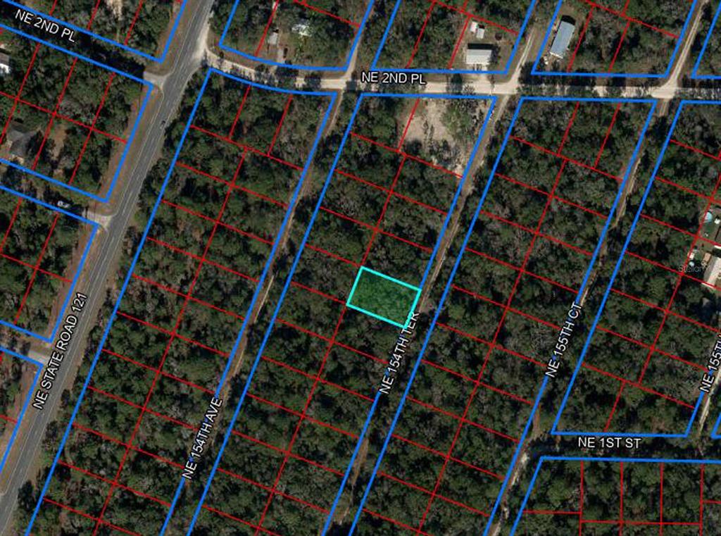 This is an aerial map showing a vacant lot highlighted in blue within a residential area — tbd NE 154TH TERRACE, WILLISTON, FL